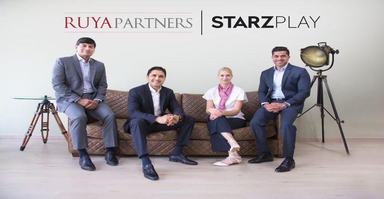 Representatives from Ruya Partners and STARZPLAY pose for a picture.