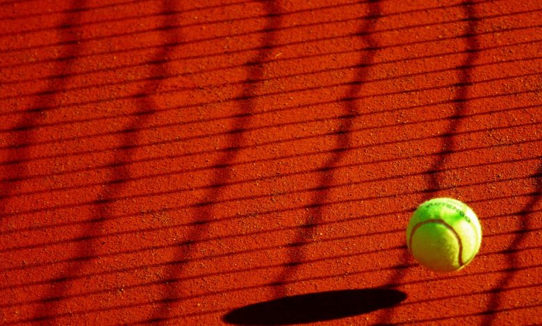 Image of tennis ball on court