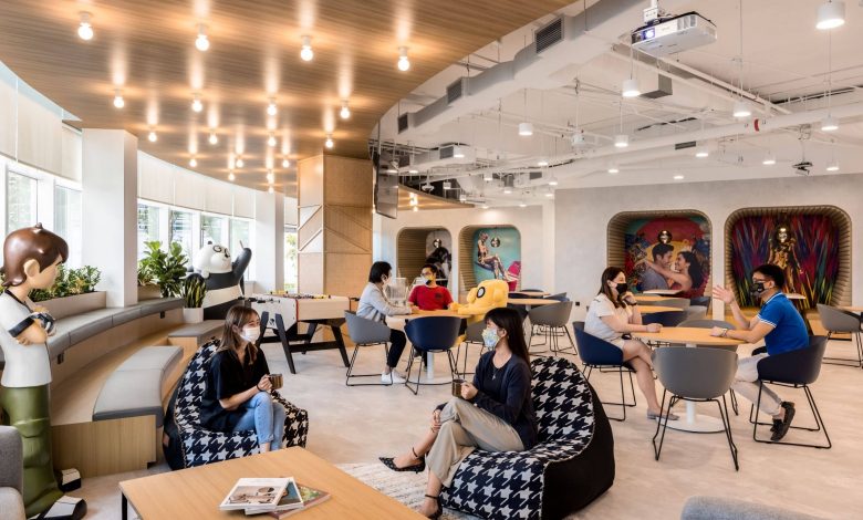 A lounge with sofas and people