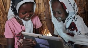 Two African children using a tablet